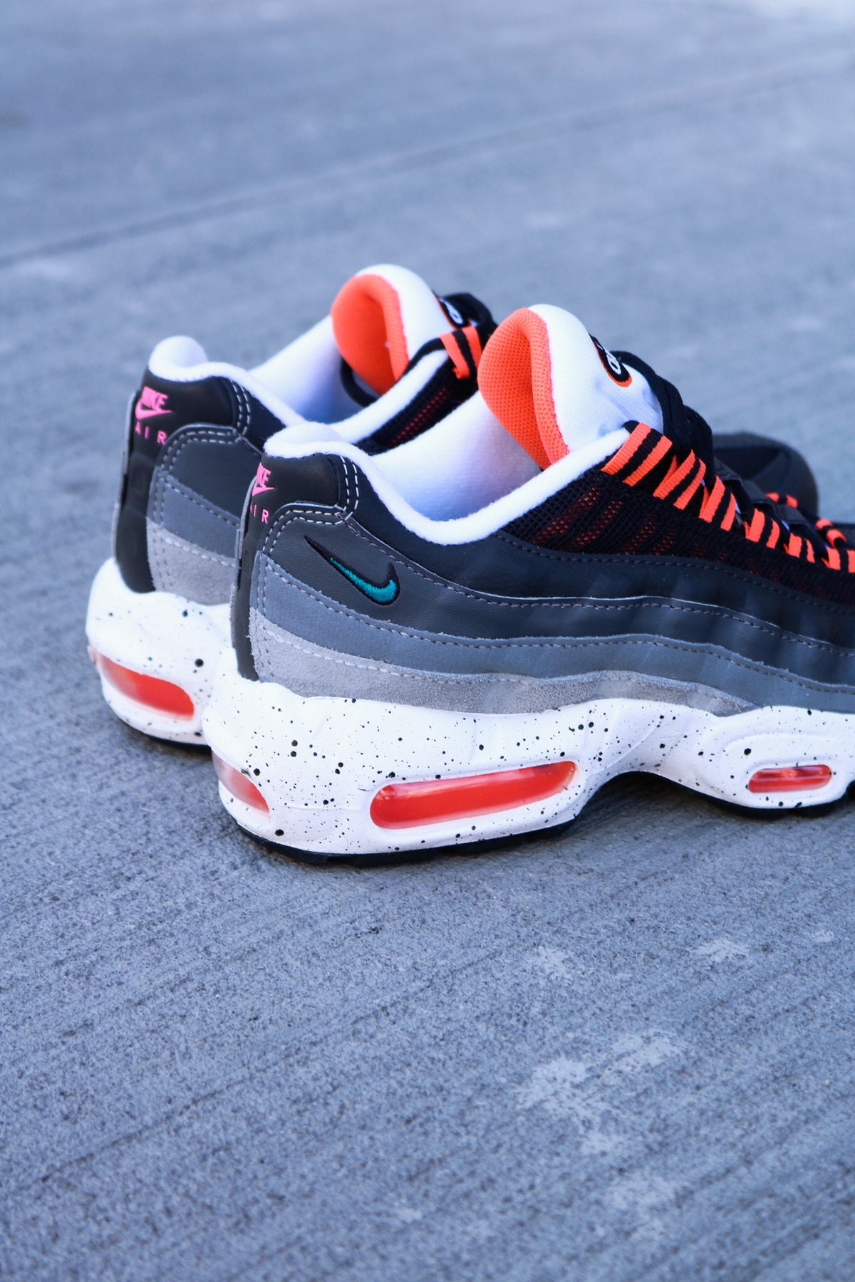 Orange air max 95s hotsell